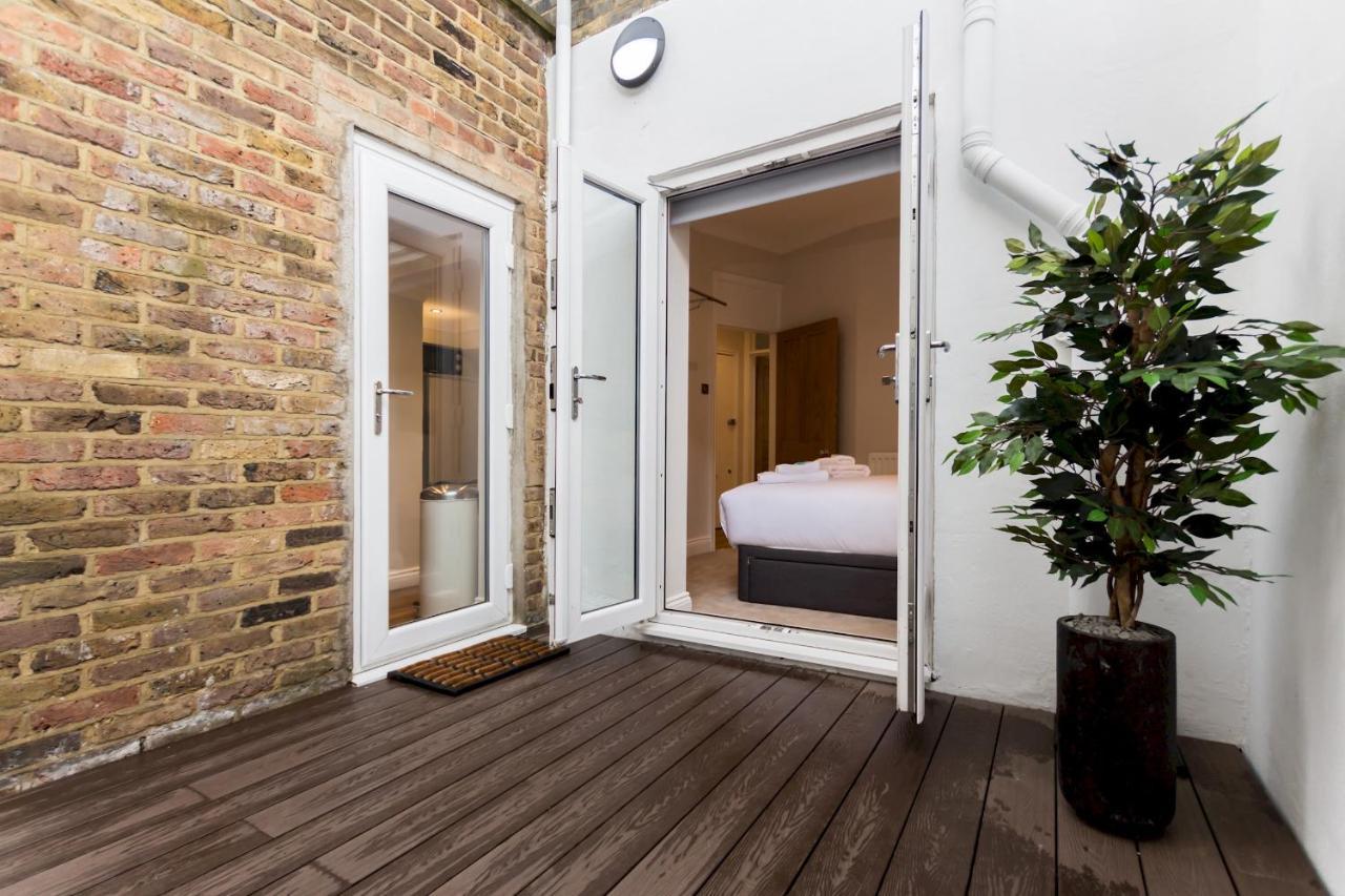 Caledonian · Bright One-Bedroom Apartment with Private Decked Garden Londen Buitenkant foto